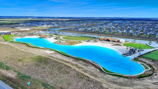 a bedroom with a bed and a view of kitchen