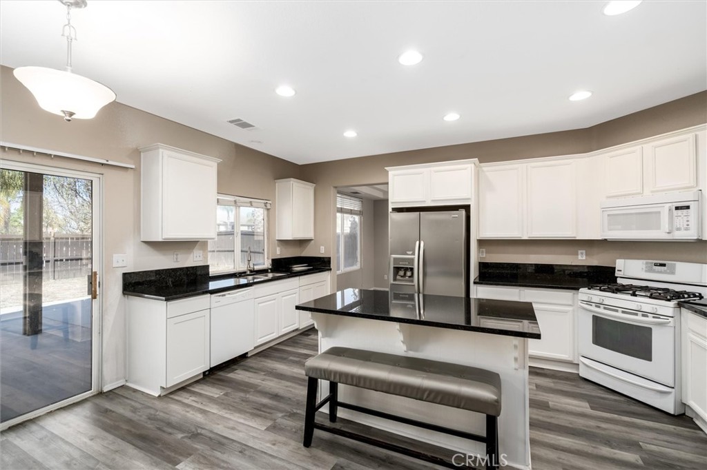 37867 Shady Maple Road Murrieta, CA 92563 - Photo 10 of 68 a kitchen with stainless steel appliances a stove a refrigerator and a sink