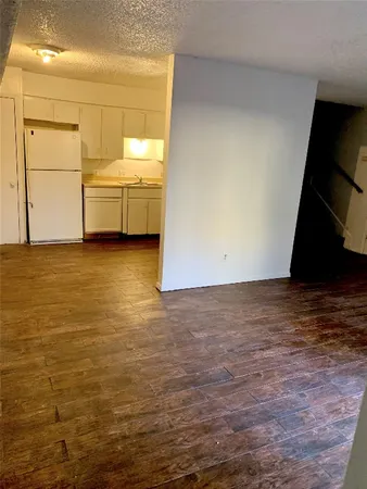 a view of a kitchen with wooden floor