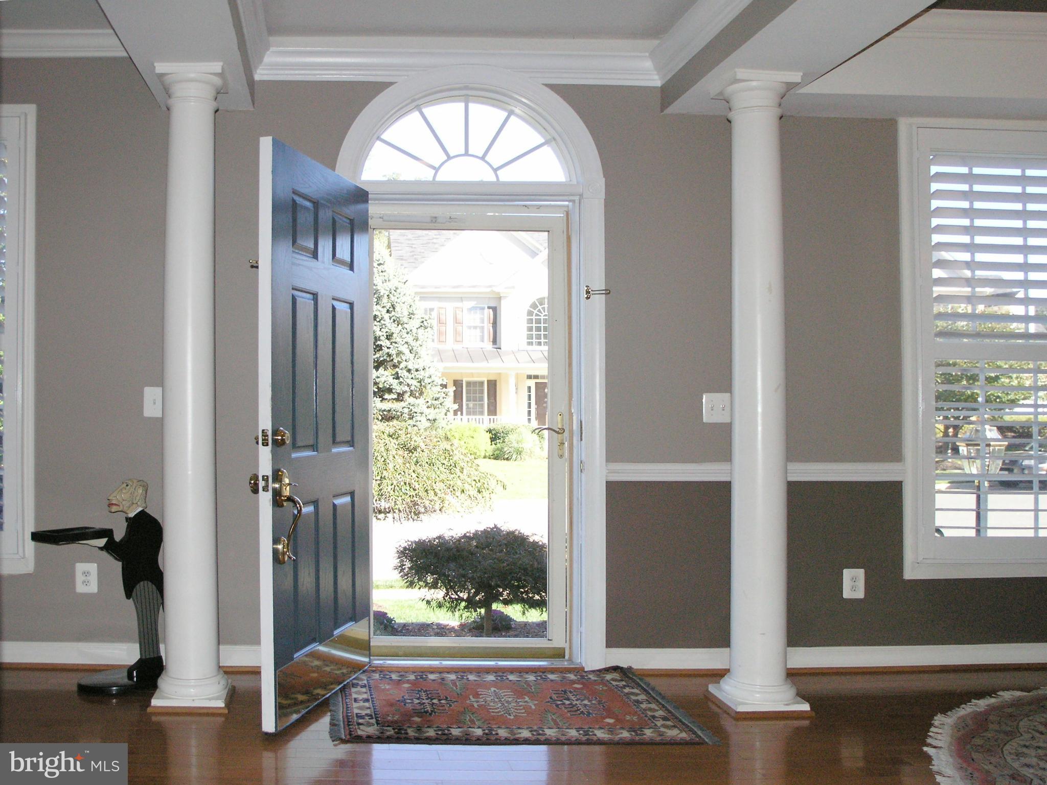 47611 Rhyolite Place Sterling, VA 20165 - Photo 2 of 29 a view of entryway with wooden floor and door