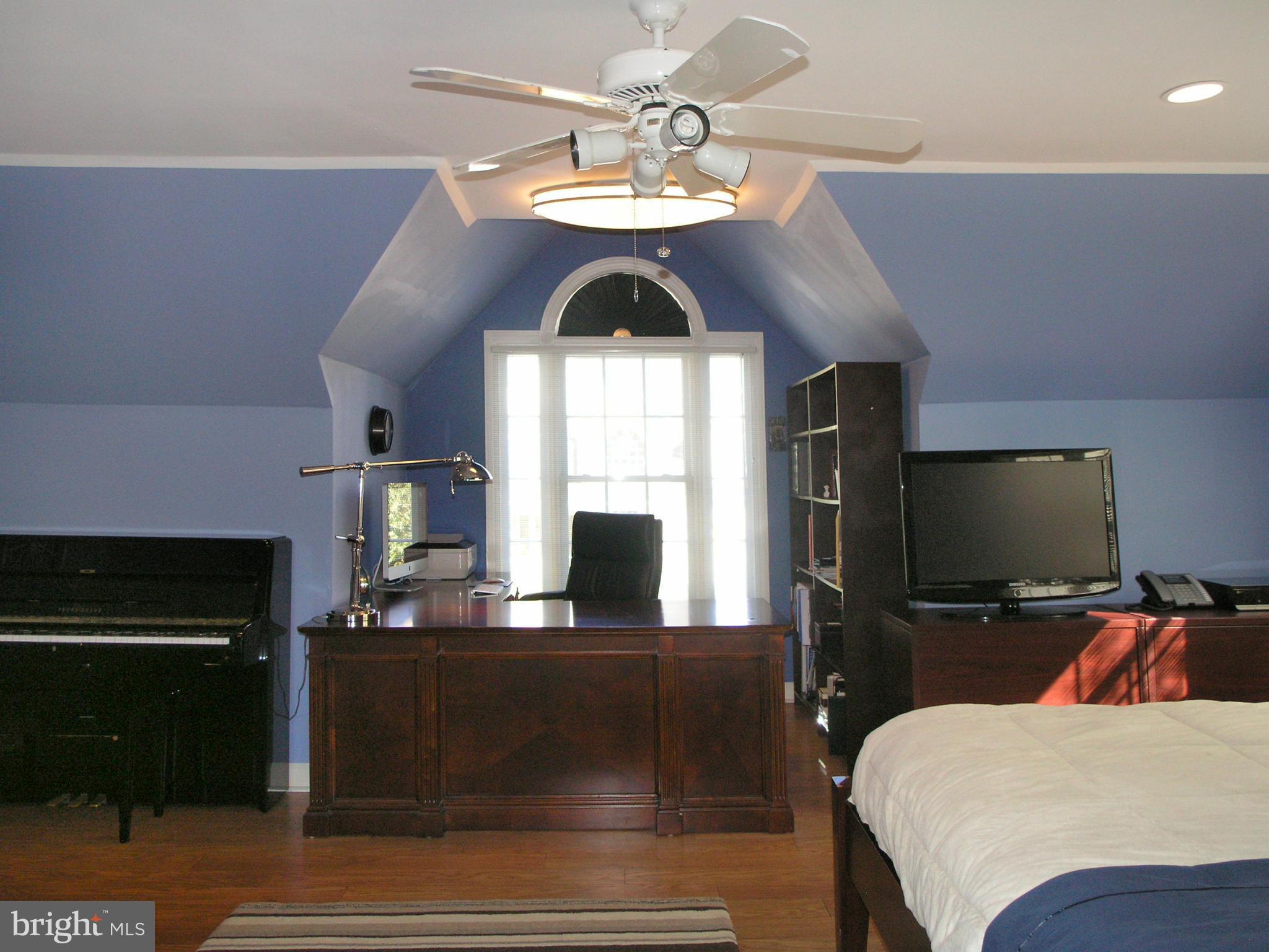 47611 Rhyolite Place Sterling, VA 20165 - Photo 15 of 29 a bedroom with a bed and a flat screen tv