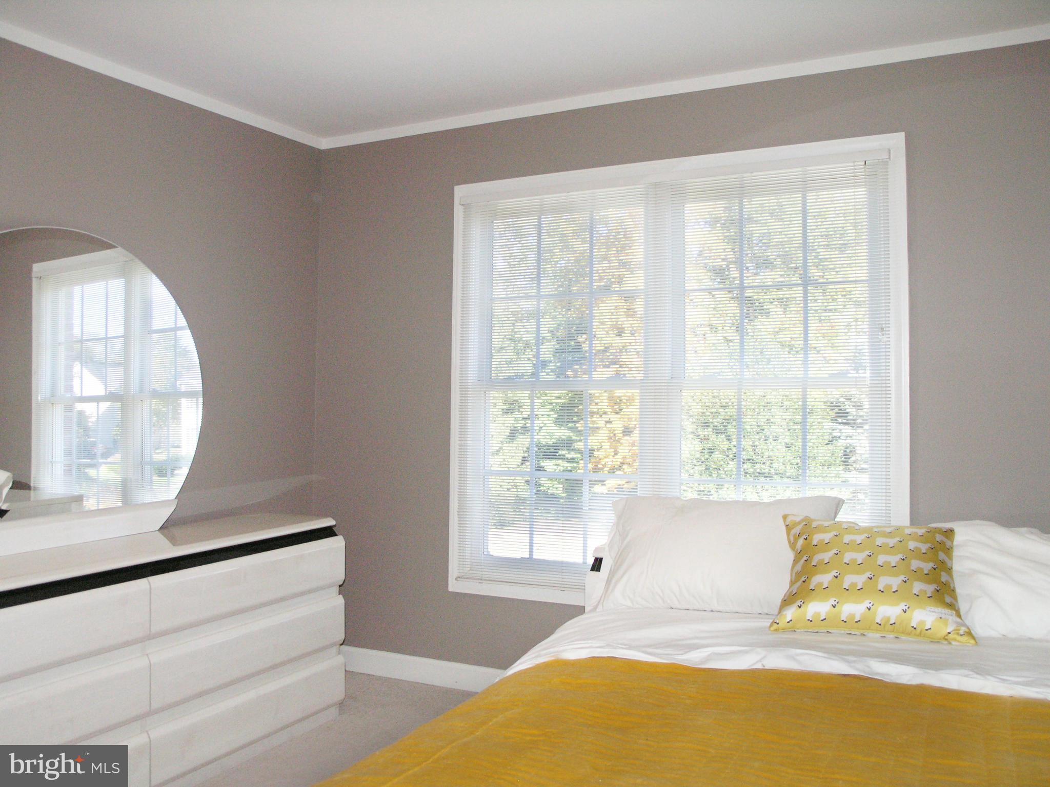 47611 Rhyolite Place Sterling, VA 20165 - Photo 18 of 29 a bedroom with a bed and a large window