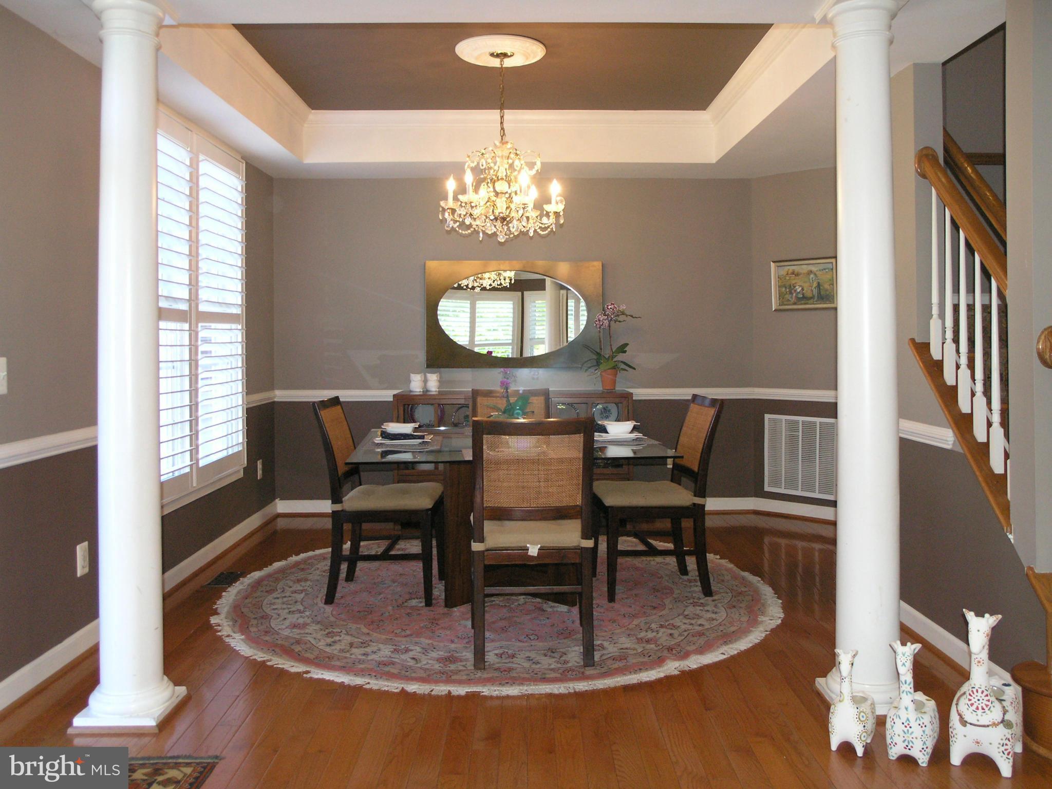 47611 Rhyolite Place Sterling, VA 20165 - Photo 3 of 29 a view of a dining room with furniture and a chandelier