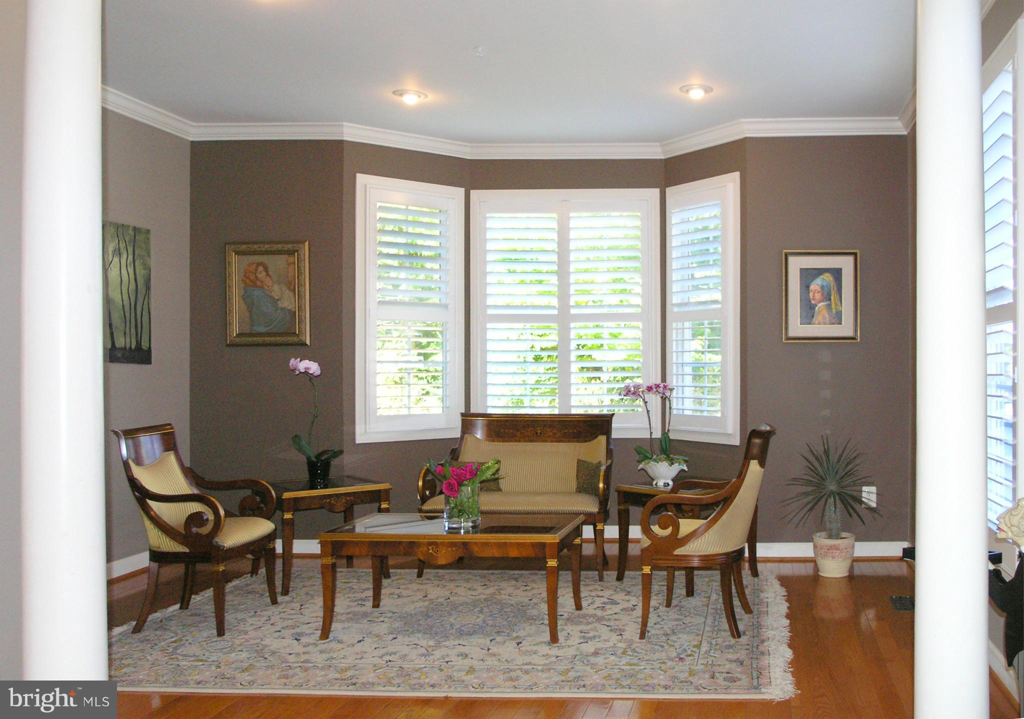 47611 Rhyolite Place Sterling, VA 20165 - Photo 4 of 29 a living room with furniture wooden floor and a window