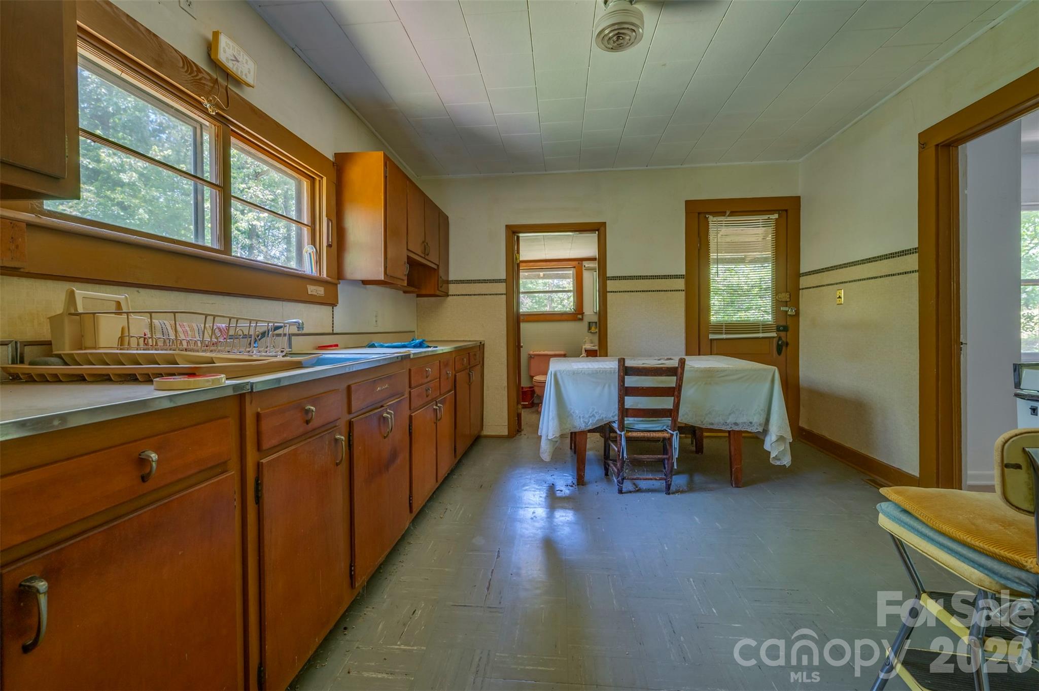 77 1st Street Tryon, NC 28782 - Photo 13 of 20 a kitchen that has a table and chairs in it