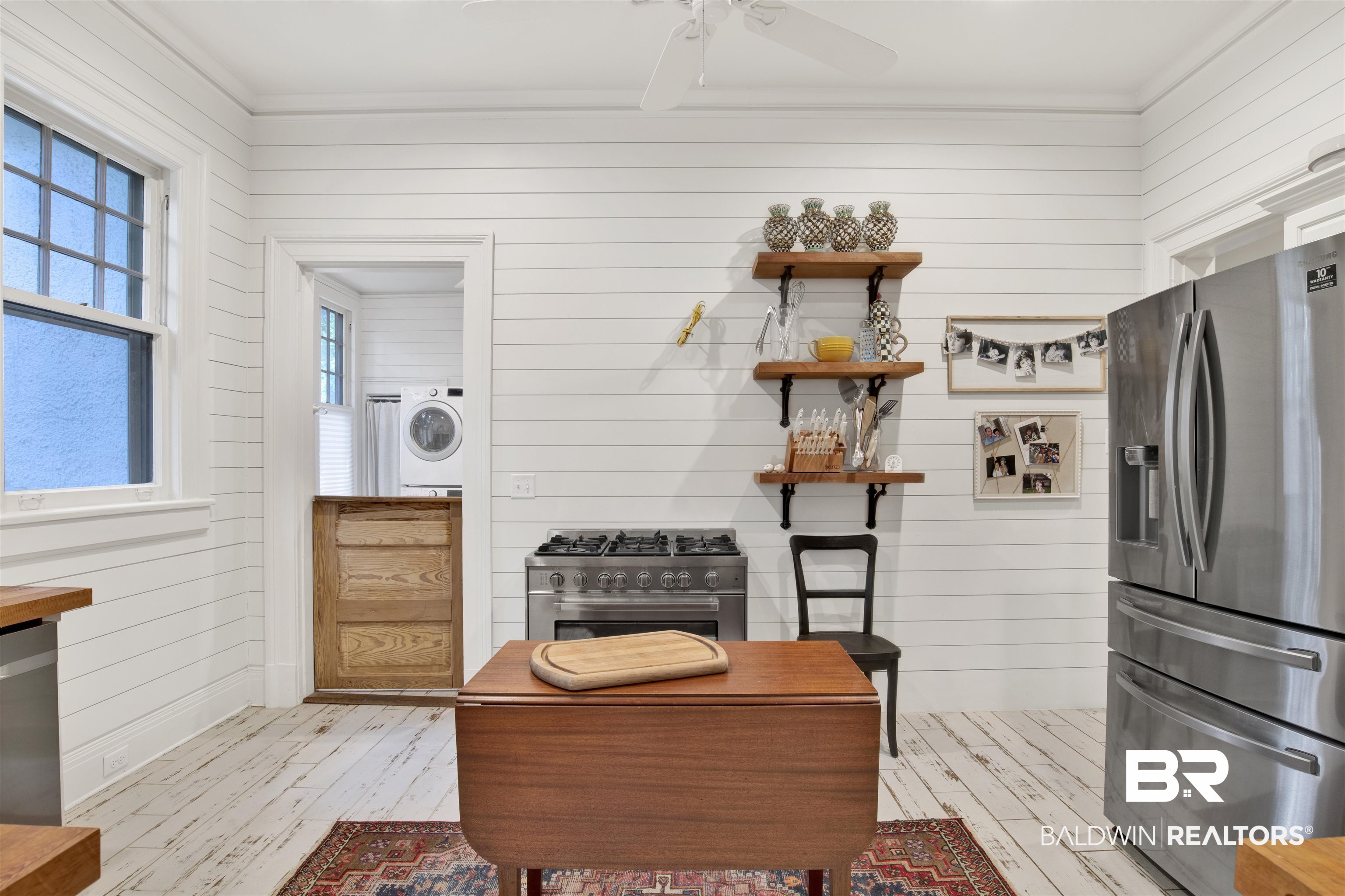 1654 Government Street Mobile, AL 36604 - Photo 26 of 45 Interior space with wooden walls, ceiling fan, and light wood-type flooring