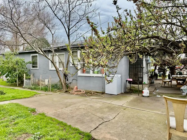 a house with garden in front of it
