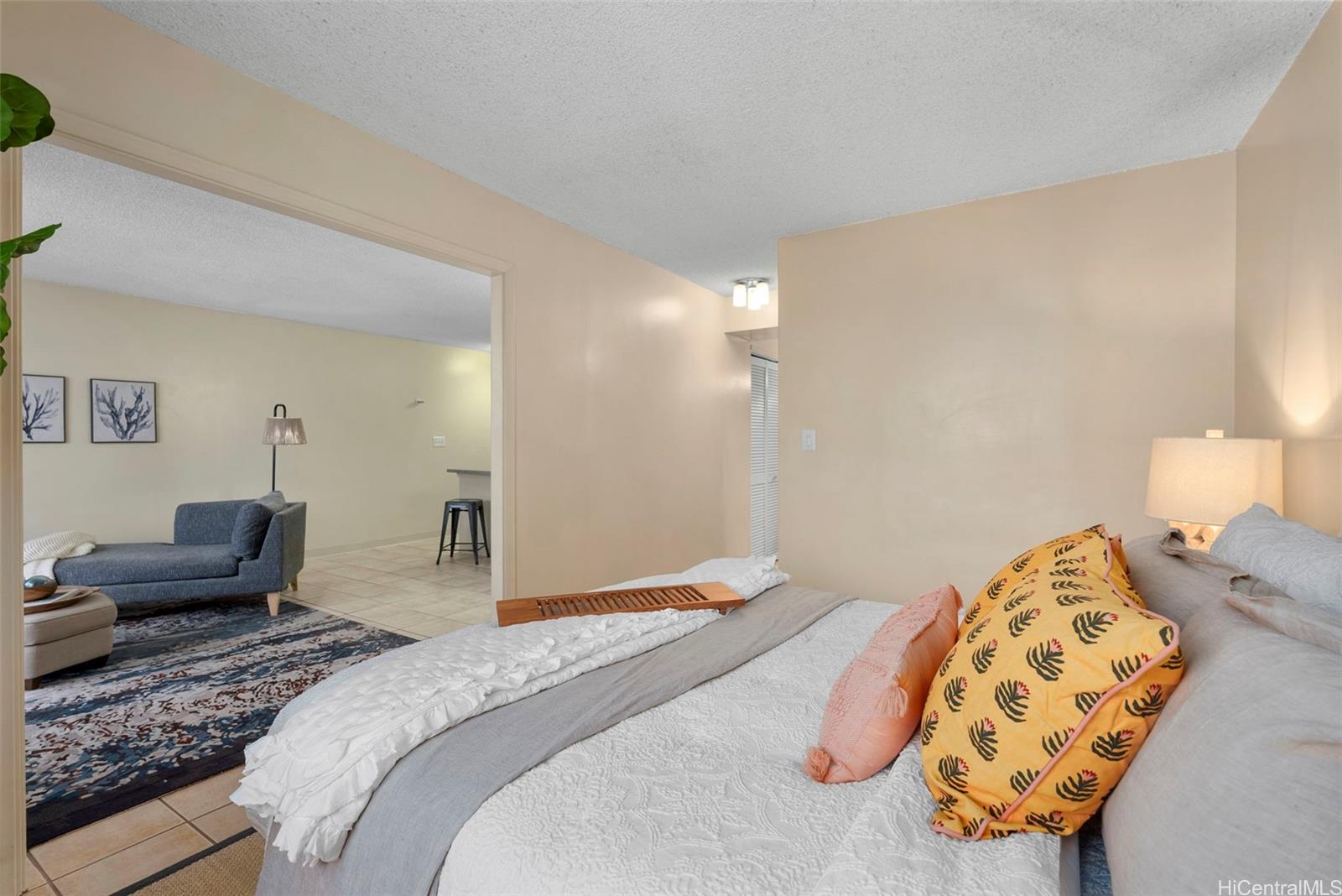 98-1038 Moanalua Road, Unit 1502 Aiea, HI 96701 - Photo 6 of 20 a bedroom with a bed and wooden floor