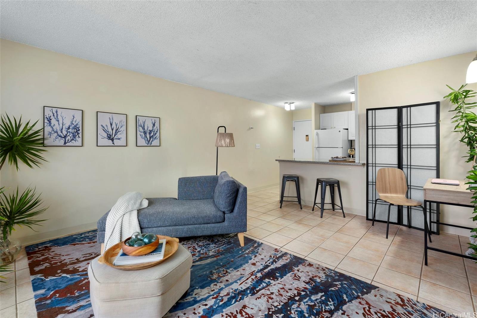 98-1038 Moanalua Road, Unit 1502 Aiea, HI 96701 - Photo 7 of 20 a living room with furniture and a wooden floor