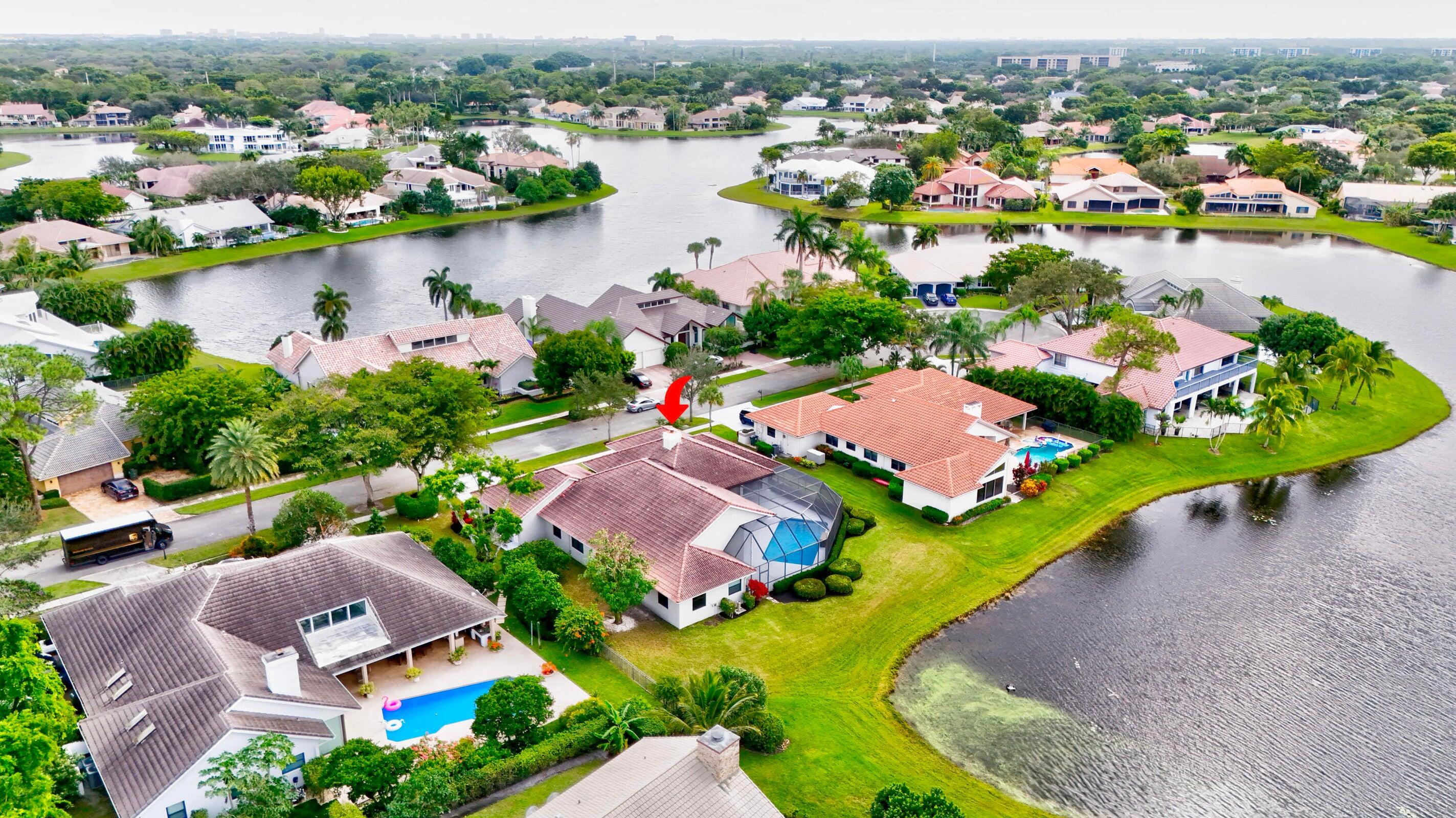 4875 Hunters Way Boca Raton, FL 33434 - Photo 42 of 43 Drone View of Home and Lake