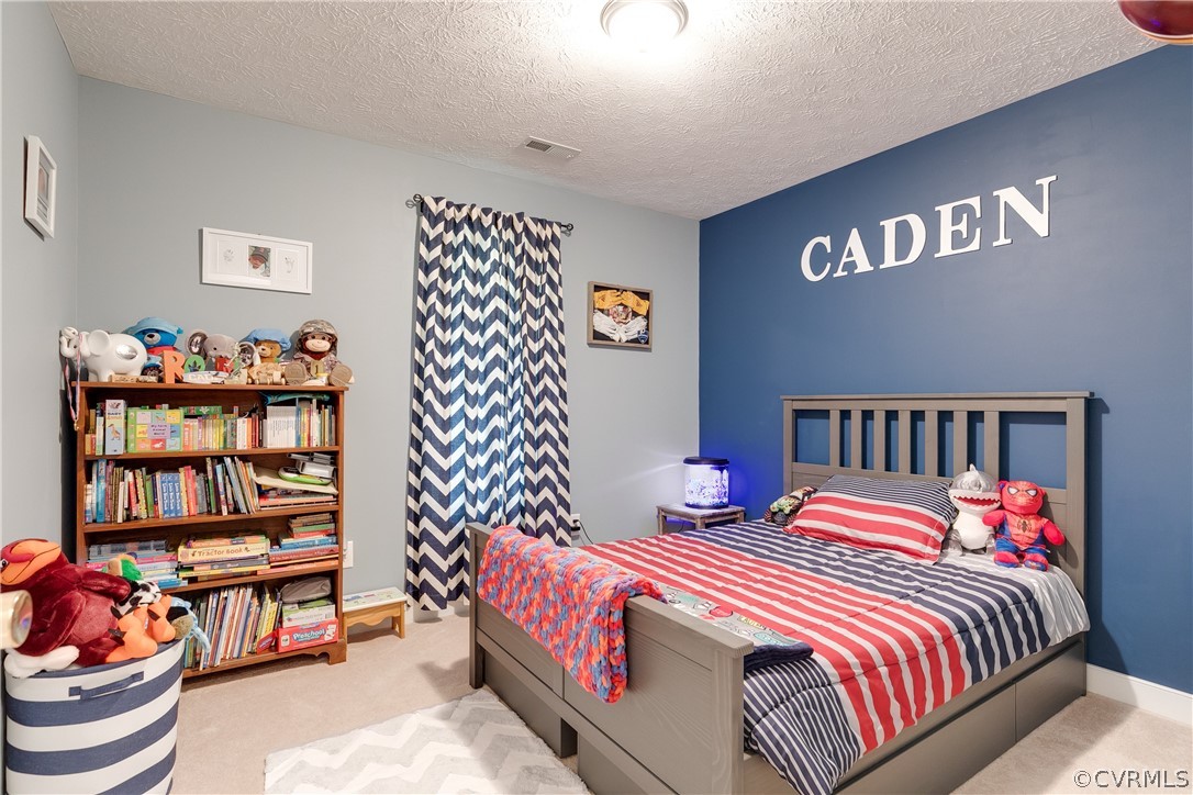 473 Winding Ridge Way Bumpass, VA 23024 - Photo 17 of 25 a bedroom with a bed and closet