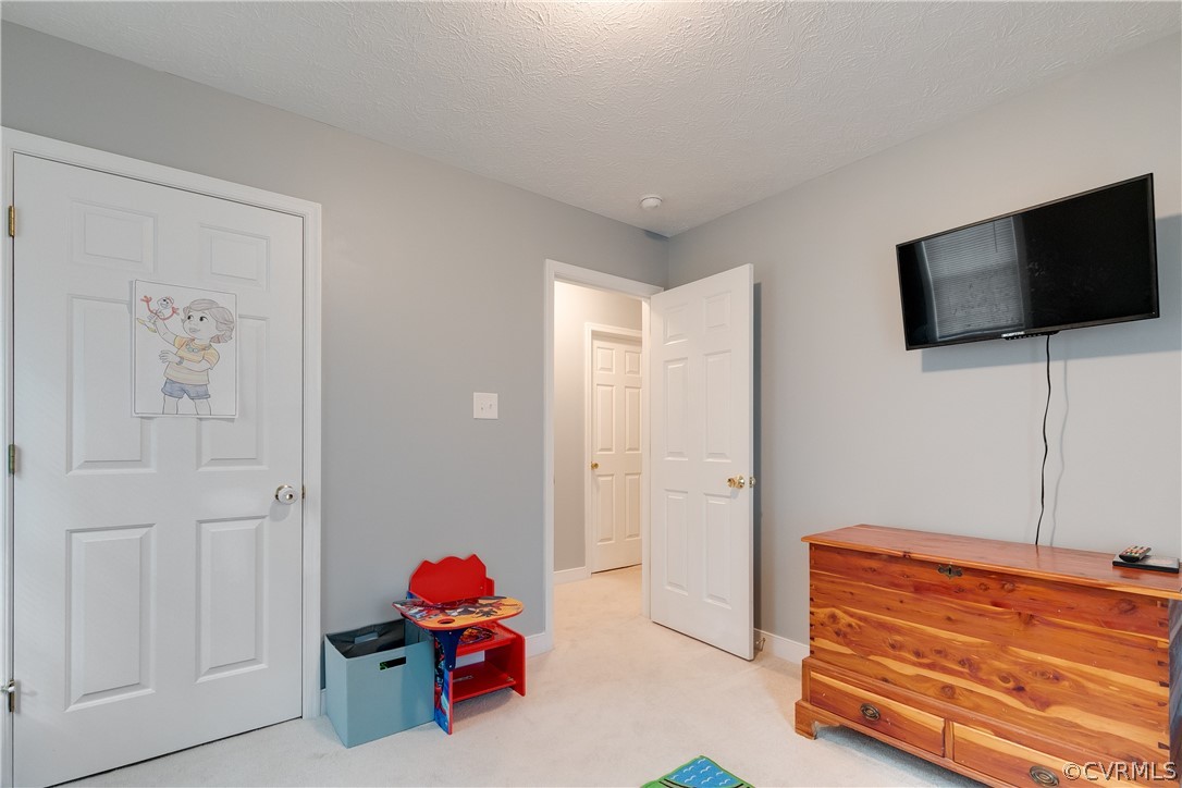 473 Winding Ridge Way Bumpass, VA 23024 - Photo 20 of 25 a living room with furniture and a flat screen tv