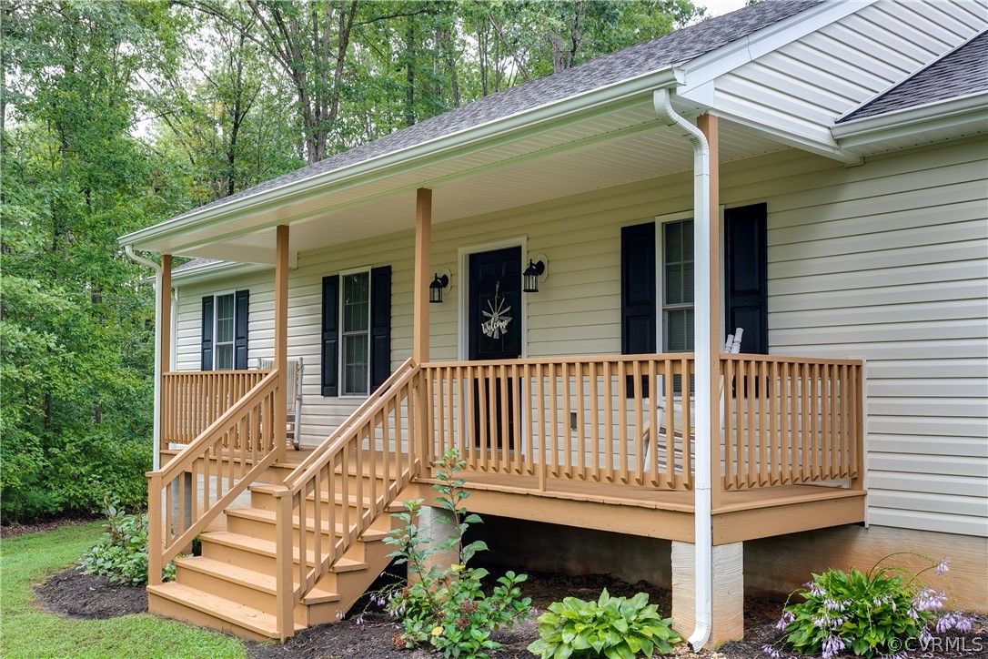 473 Winding Ridge Way Bumpass, VA 23024 - Photo 2 of 25 a view of a house with wooden deck and a yard