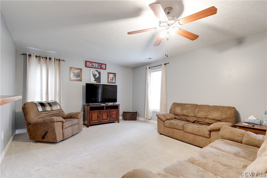473 Winding Ridge Way Bumpass, VA 23024 - Photo 3 of 25 a living room with furniture and a flat screen tv