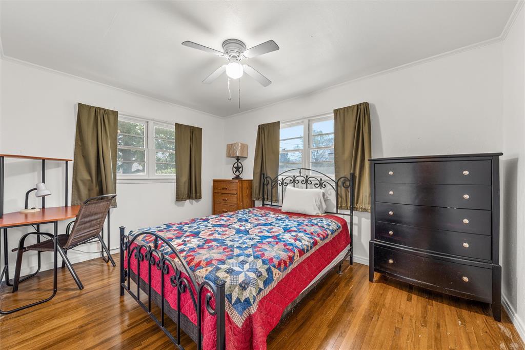 110 Butler Drive Valley Mills, TX 76689 - Photo 12 of 26 a bedroom with a bed and wooden floor