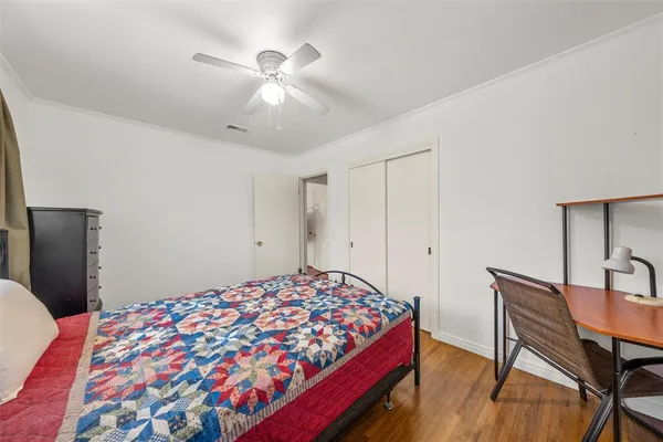 a bedroom with a bed and a table in it