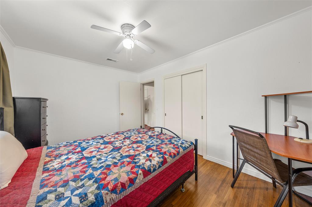 110 Butler Drive Valley Mills, TX 76689 - Photo 13 of 26 a bedroom with a bed and a table in it