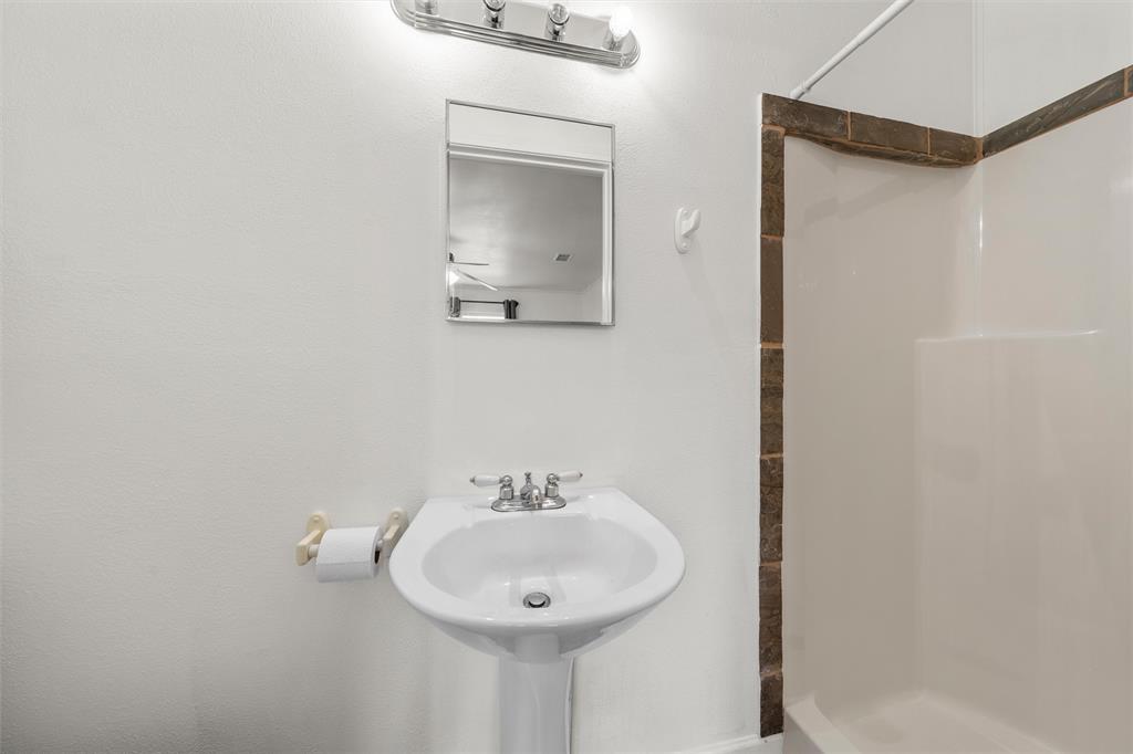 110 Butler Drive Valley Mills, TX 76689 - Photo 14 of 26 a bathroom with a sink and a mirror