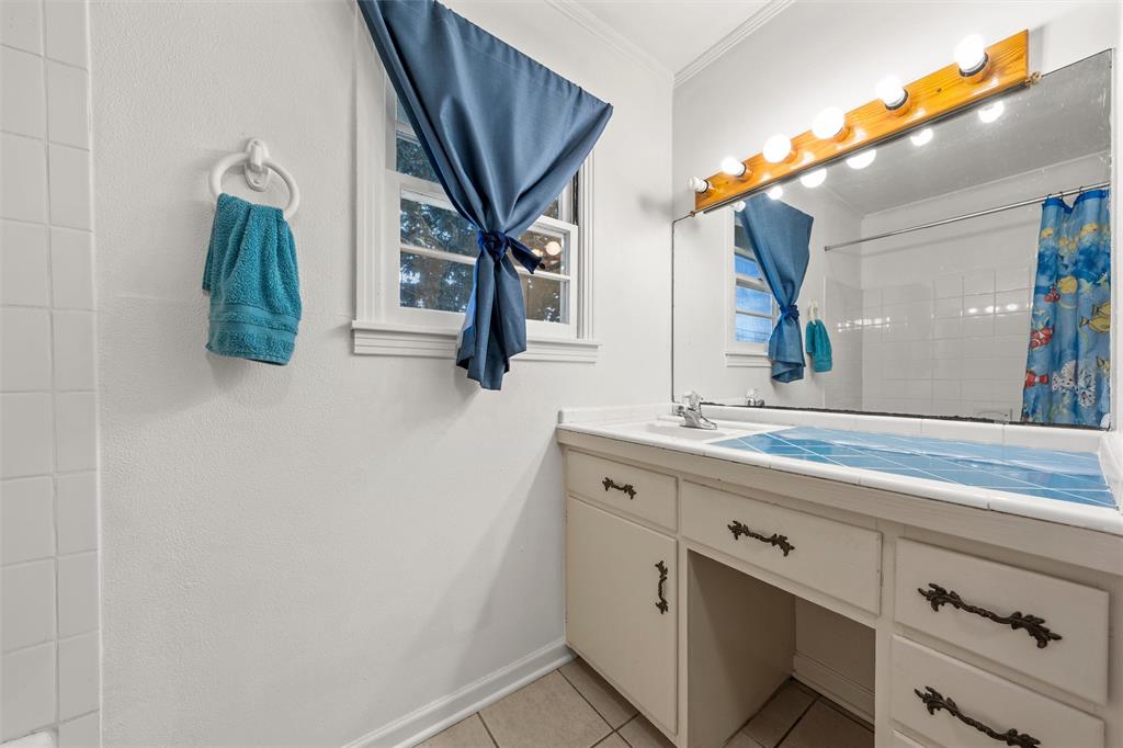 110 Butler Drive Valley Mills, TX 76689 - Photo 21 of 26 a bathroom with a sink and a mirror