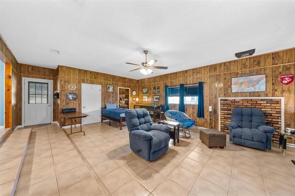 110 Butler Drive Valley Mills, TX 76689 - Photo 4 of 26 a living room with furniture and a chandelier