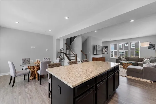 a kitchen with a table and chairs