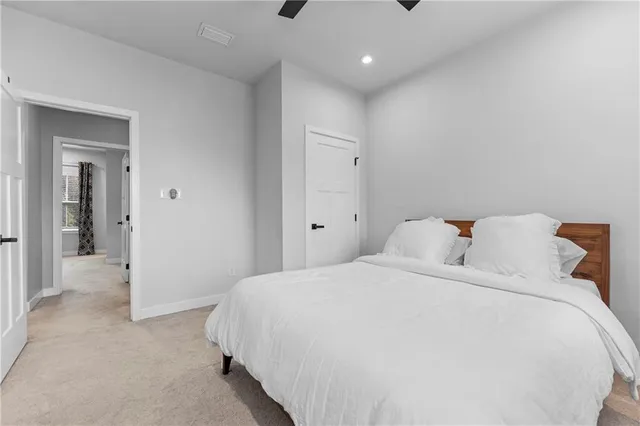 a bedroom with a bed and closet