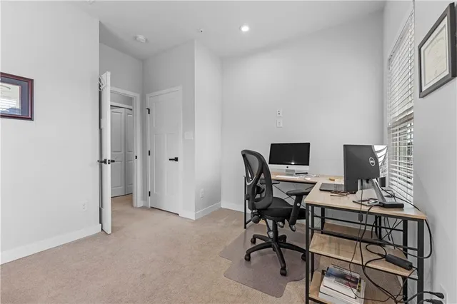 a workspace with furniture and a gate