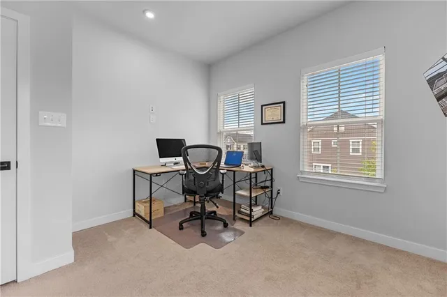 a workspace with furniture and a window