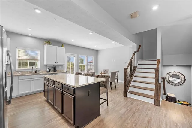 a kitchen with sink stove and cabinets