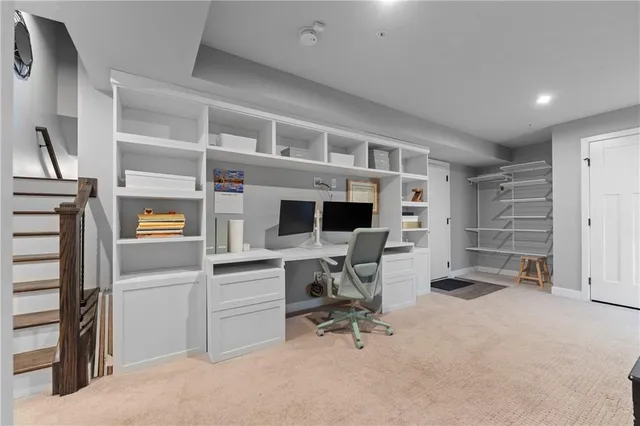 a view of a workspace with furniture