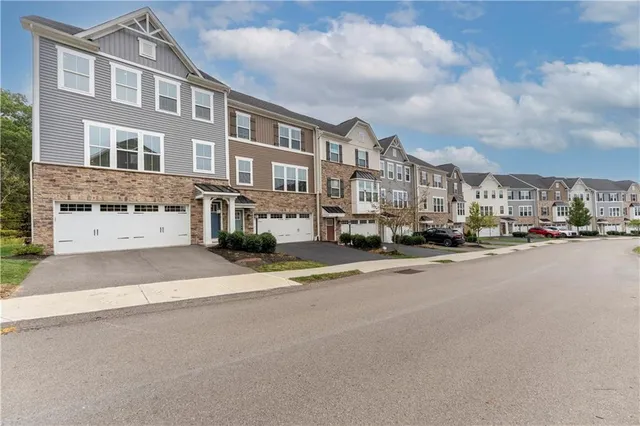 a city street lined with buildings and cars