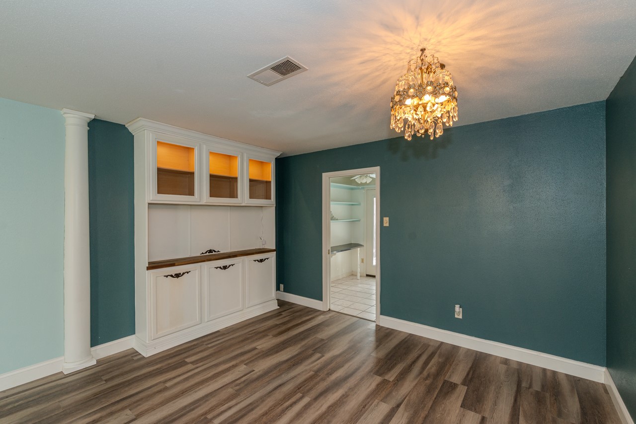 5975 Meadow Way Beaumont, TX 77707 - Photo 5 of 18 a view of a kitchen with a sink and dishwasher with wooden floor