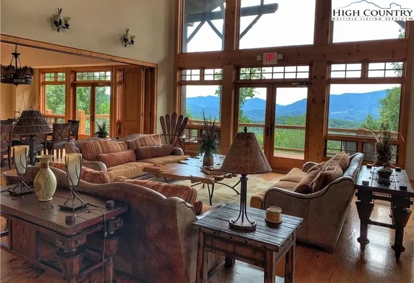 a kitchen with granite countertop a stove top oven a sink dishwasher and cabinets with wooden floor