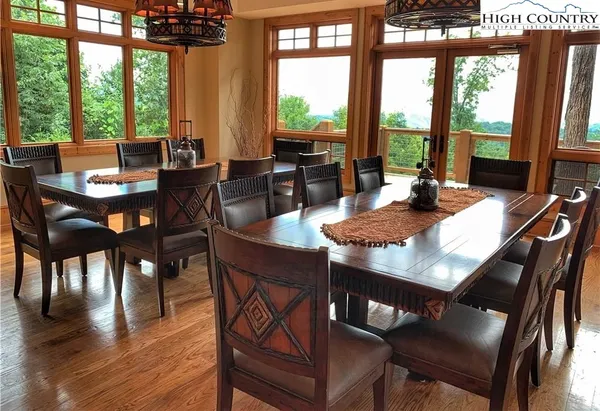 a view of a dining room with furniture window and outside view