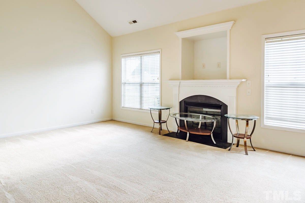 1908 Cartier Ruby Lane Raleigh, NC 27610 - Photo 8 of 15 an empty room with furniture and windows