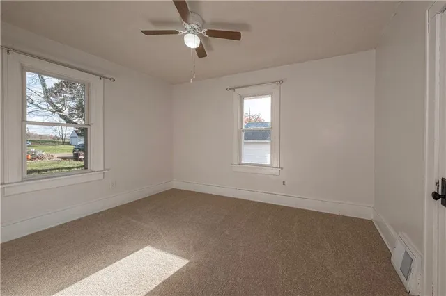 a view of empty room with windows