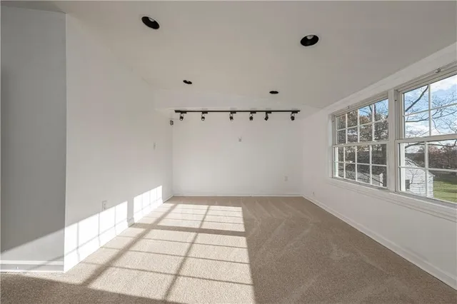 a bathroom with a sink toilet tub and shower
