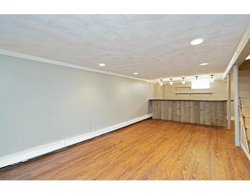 97 Meadowbrook Road Chelmsford, MA 01863 - Photo 11 of 15 a view of a big room with wooden floor and windows