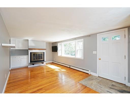 97 Meadowbrook Road Chelmsford, MA 01863 - Photo 3 of 15 a view of an empty room with a fireplace and a window
