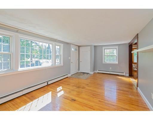 97 Meadowbrook Road Chelmsford, MA 01863 - Photo 4 of 15 a view of an empty room with wooden floor and a window