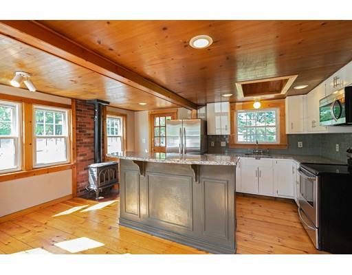 97 Meadowbrook Road Chelmsford, MA 01863 - Photo 5 of 15 a kitchen with granite countertop a stove a sink and a microwave