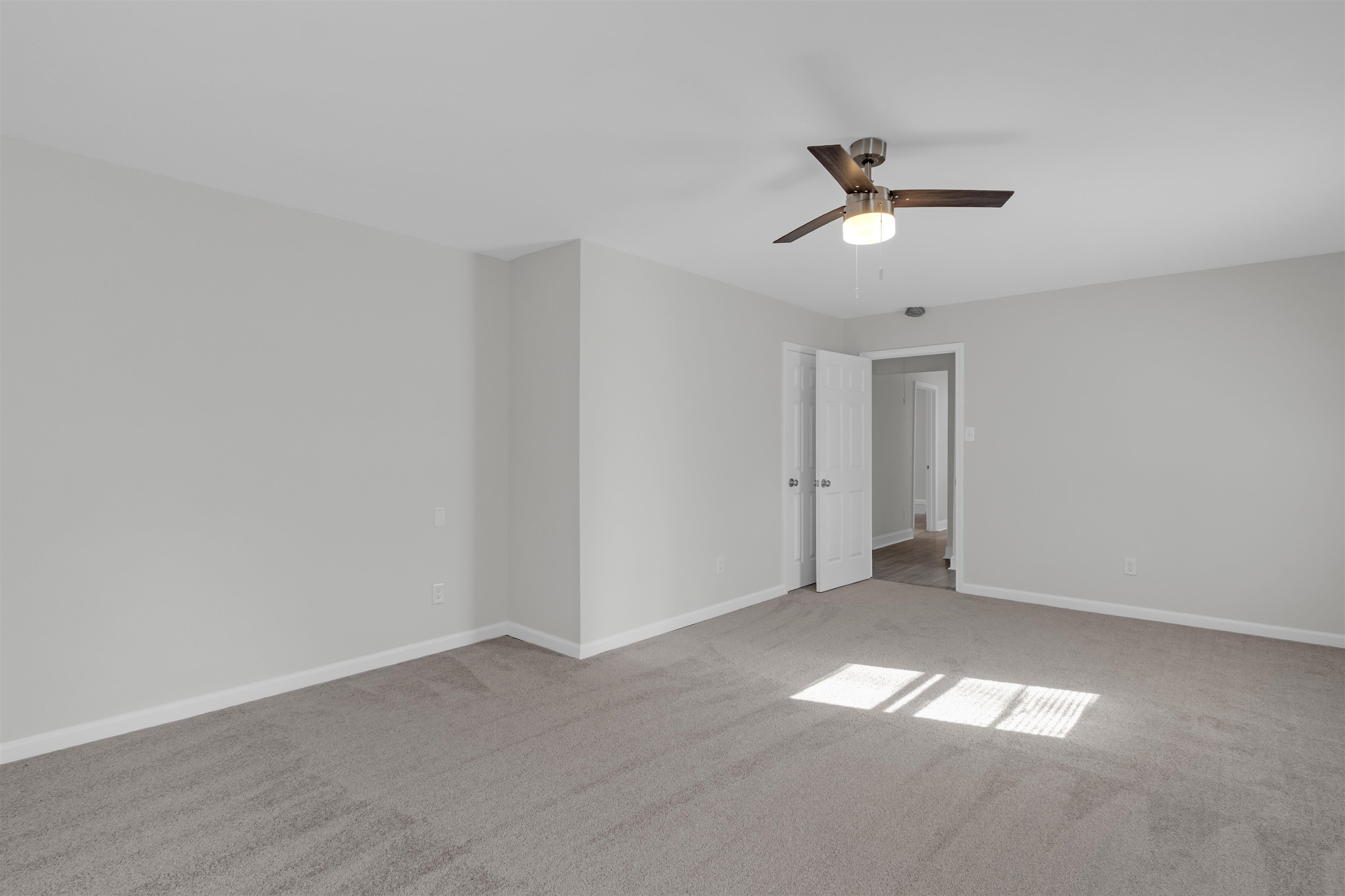 1296 Monasco Road Millington, TN 38053 - Photo 19 of 32 Empty room with ceiling fan and light colored carpet