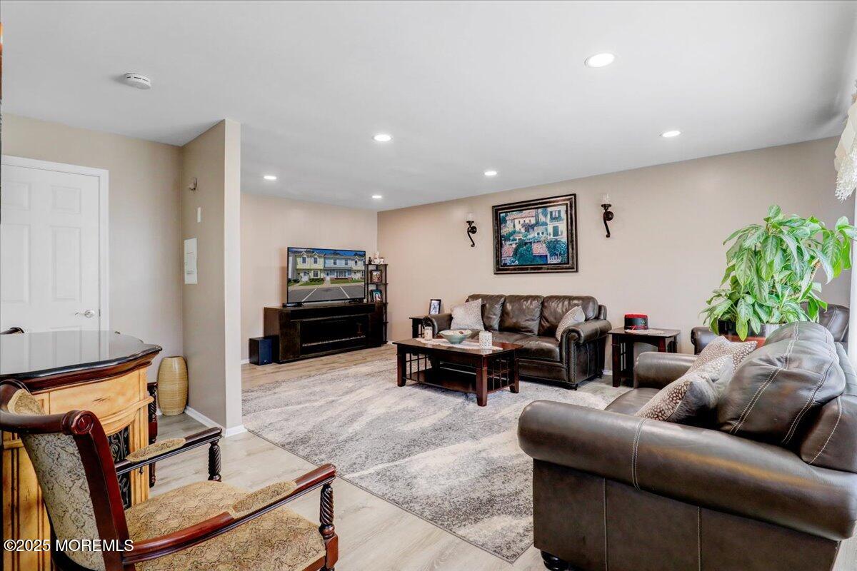 111 Joan Court Jackson, NJ 08527 - Photo 2 of 22 a living room with furniture and a flat screen tv