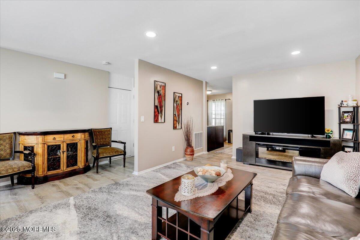 111 Joan Court Jackson, NJ 08527 - Photo 3 of 22 a living room with furniture and a flat screen tv