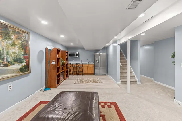 a view of an entryway with wooden floor