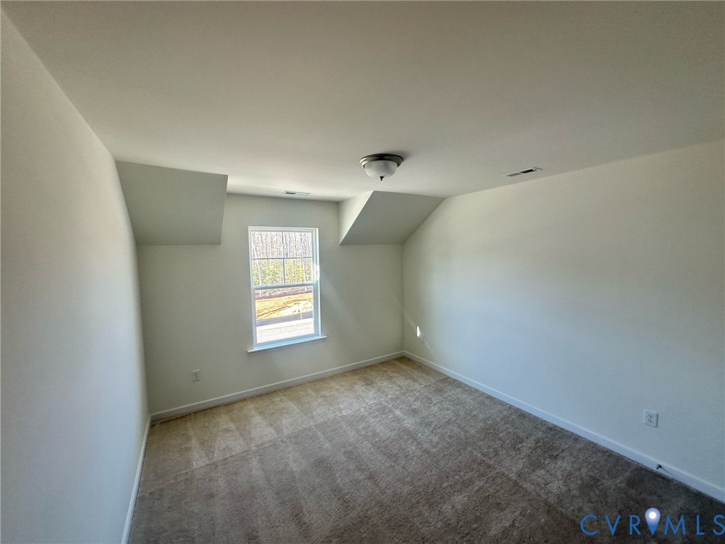 12737 Deep Wl Road Midlothian, VA 23112 - Photo 14 of 17 an empty room with a window and windows