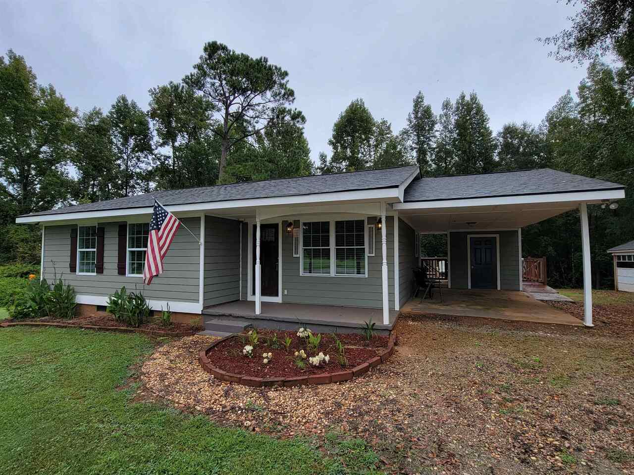 1185 South Ola Road Locust Grove, GA 30248 - Photo 1 of 1 front view of a house with a yard