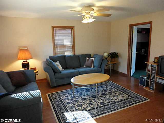 7349 Drexelbrook Road Chesterfield, VA 23832 - Photo 16 of 24 a living room with furniture and a rug