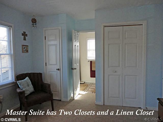 7349 Drexelbrook Road Chesterfield, VA 23832 - Photo 19 of 24 a living room with a couch and a view of bathroom