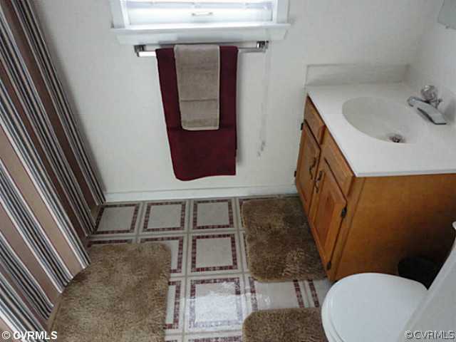 7349 Drexelbrook Road Chesterfield, VA 23832 - Photo 20 of 24 a bathroom with a toilet mirror and sink